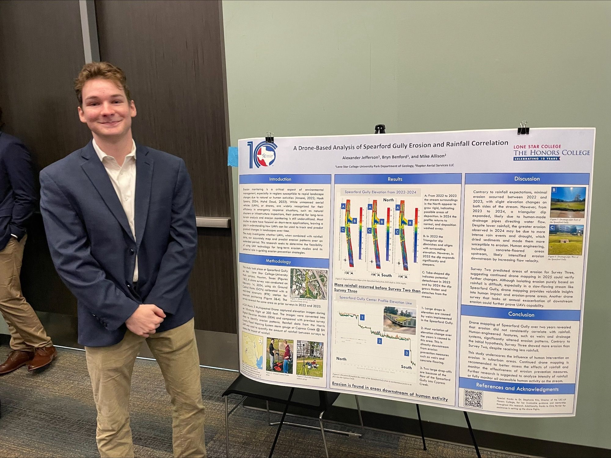 AJ Jefferson standing in front of his research poster