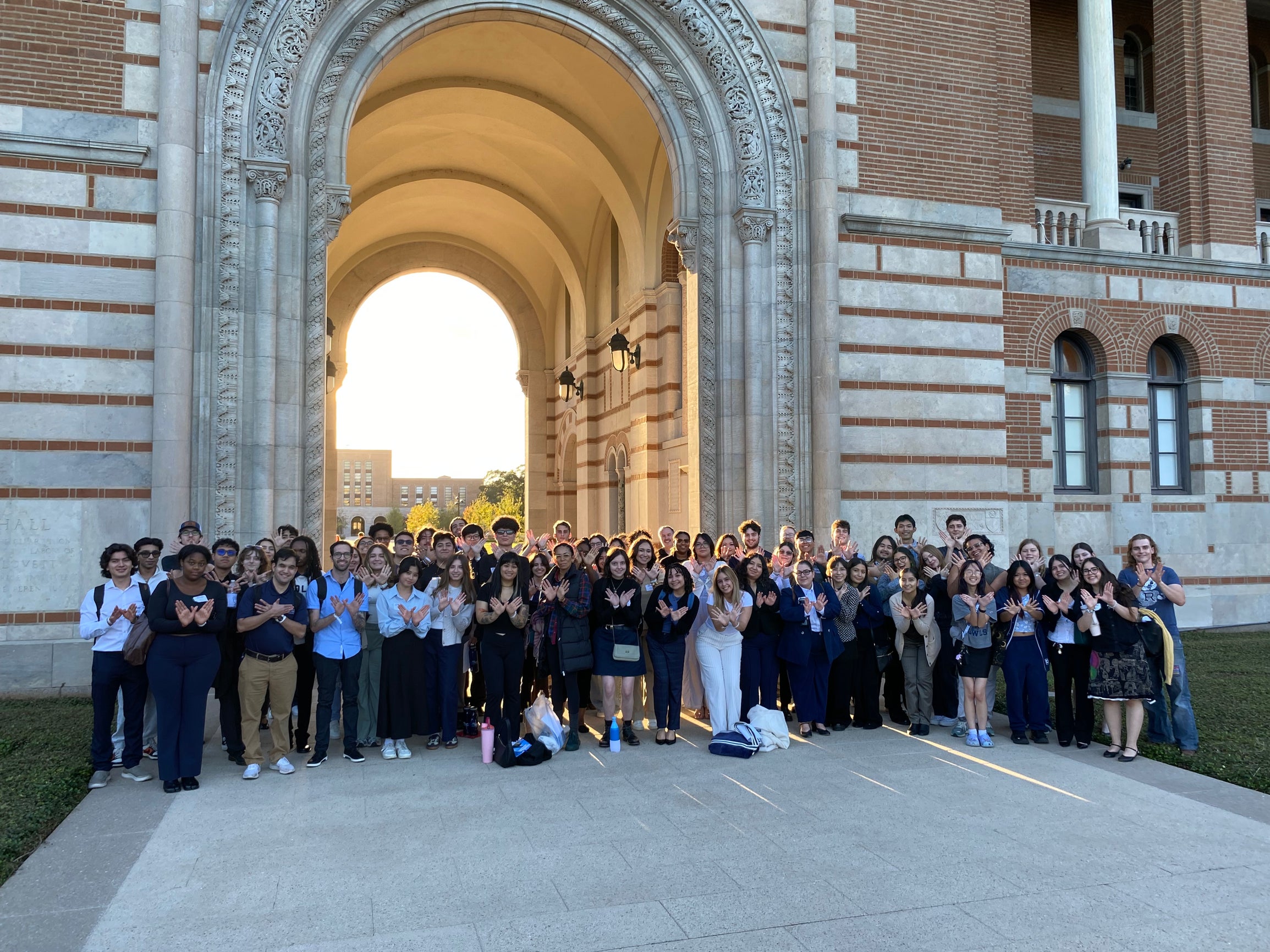 Group of Take Flight students under the sallyport at Rice University